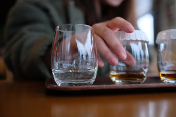 Whiskey tasting - lady's hand