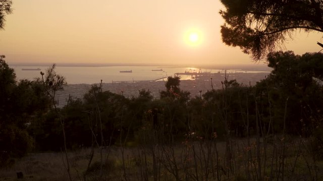 Thessaloniki / Greece 22 march 2019 : sunset in the most beautiful city of Greece photo taken from the hilltop forest Kedrinos Lofos, also known as Seich Sou,the temperture is fine for a walk