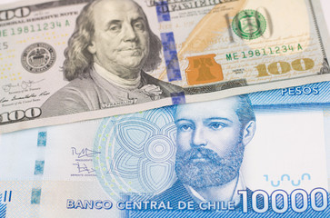 one hundred american dollar and ten thousands chilean pesos banknotes