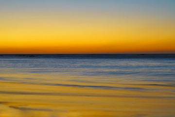 Fototapeta na wymiar Dramatic orange sunset sky over the Playa Virador beach in Peninsula Papagayo, Guanacaste, Costa Rica