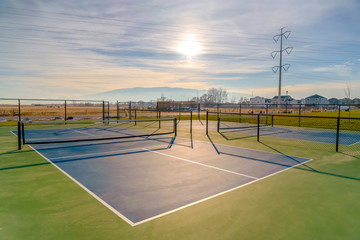 Tennis courts with beautiful sunny sky background