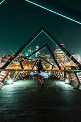 woman standing on a bridge 