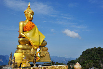 golden sitting buddha in tiger temple in Crabi - 257559397