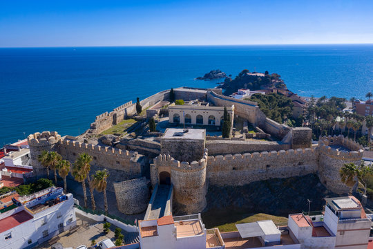 Almunecar aerial view of popular Mediterranean beach town with medieval castle in Spain