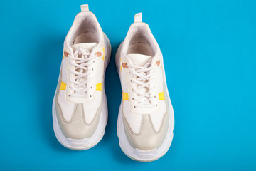 Fitness equipment. Sneakers, on blue background