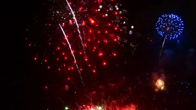 Bright colourful fireworks exploding against a black night sky
