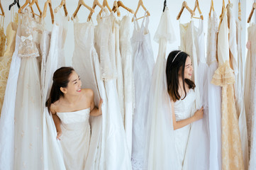 Portrait of beautiful asian woman bride funny together,Ceremony in wedding day,Happy and smiling