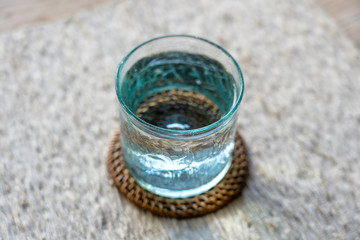 Glass with cool fresh water on a table, closeup