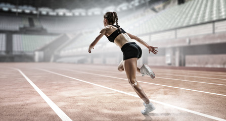 Obraz premium Sportswoman running race. Mixed media