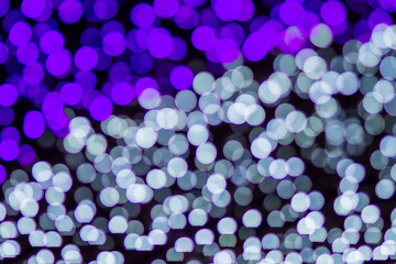 Violet and white abstract bokeh illumination background. Christmas and new year theme