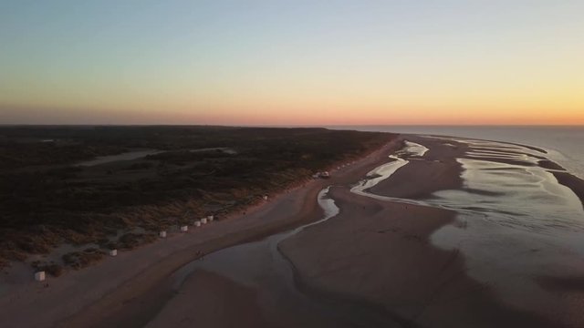 Sunset at the Dutch beach Breezand in Zeeland. Aerial shot.