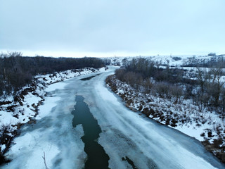 The river in early spring, when the ice has not yet broken. Aerial view.