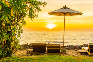 Beautiful Landscape of sea ocean on sky with umbrella and chair around there at sunset