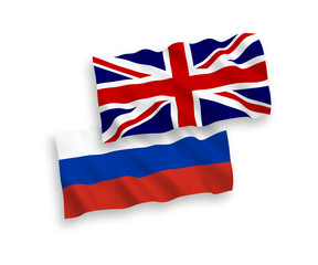 Great Britain and Russian flags isolated on white background. Vector illustration of the United Kingdom und Russia waving flags 1 to 2 proportion.
