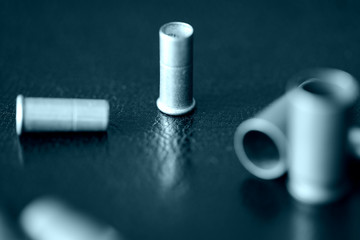 Empty old bullet cartridges close up. Blue color toned