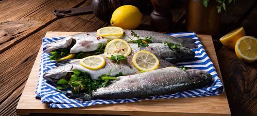 fresh trout with lemon and different herbs