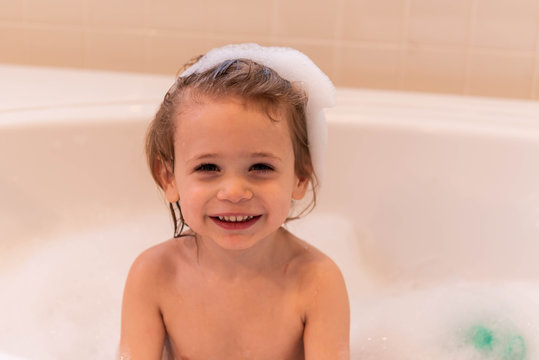 Little boy enjoying a bubble bath