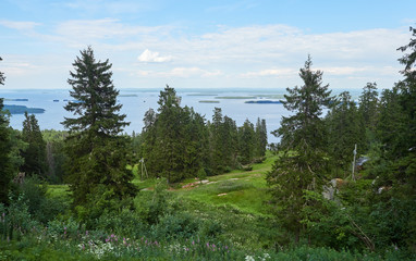 Scenic summer landscape view over the lake Pielinen from the top of the UkkoKoli, a fell at the Koli national park in Joensuu, Finland, the land of a thousand lakes.