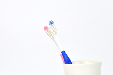 tooth brushes in glass