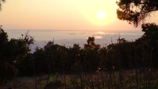 Thessaloniki / Greece 22 march 2019 : sunset in the most beautiful city of Greece photo taken from the hilltop forest Kedrinos Lofos, also known as Seich Sou,the temperture is fine for a walk