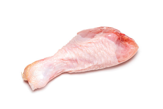 Raw chicken leg on white background, isolate 