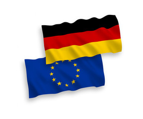National vector fabric wave flags of European Union and Germany isolated on white background. 1 to 2 proportion.
