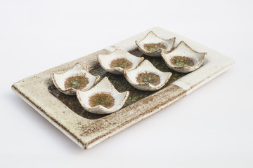 six ceramic stoneware wells with white background