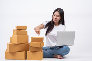 Happy women from ordering products from customers, business owners who work at home on a white background, Online shopping business operators Independent work concept.