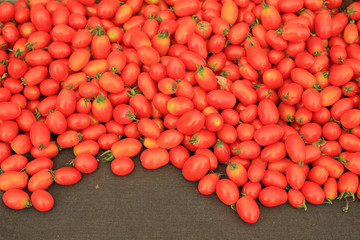 Red cherry tomatoes on sale at local market.
