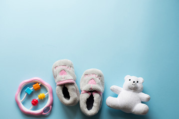 child toys on blue background. baby flat lay with copy space