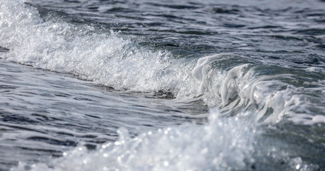 Waves on the seashore as an abstract background