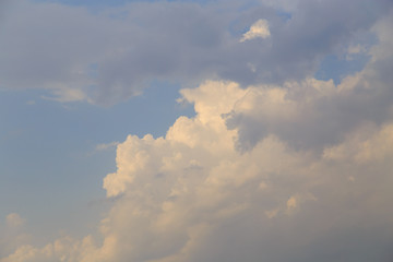 Clouds after rain before sunset as a background