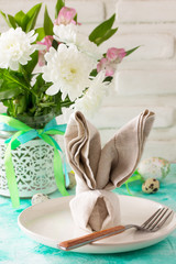 Holidays Easter table Setting with spring flowers.