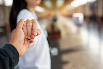 Men and women are happy at the bus station. Tourism concept