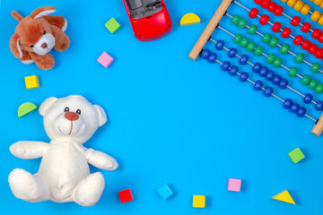 Baby kids toys frame on blue background. Top view. Flat lay