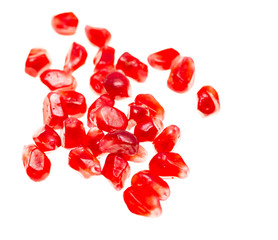 pomegranate seeds on white background