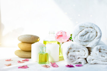 Spa, beauty treatment and wellness background Towel Cosmetic Massage oil, flowers and candel
