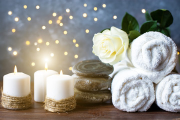 Fototapeta na wymiar Spa, beauty treatment and wellness background Towel Cosmetic Massage oil, flowers and candel