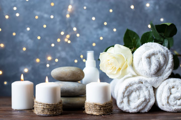 Fototapeta na wymiar Spa, beauty treatment and wellness background Towel Cosmetic Massage oil, flowers and candel