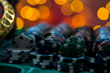 Casino theme. High contrast image of casino roulette, and poker chips