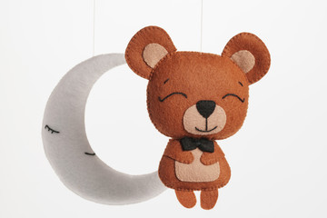 Colorful and eco-friendly children's mobile from felt. On white background.