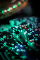 Casino theme. High contrast image of casino roulette, and poker chips