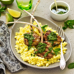 Lamb chops on bone, with mint-garlic sauce and couscous.