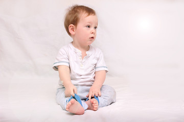 Portrait of a beautiful 6 months baby smiling, on white background