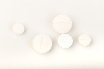 white ablets on white background