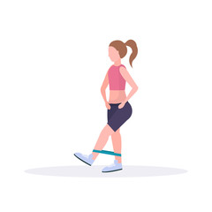 sporty woman doing exercises with resistance band girl training in gym stretching workout healthy lifestyle concept flat white background