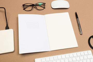 office desk table with  keyboard notebook disk glasses and scissors. Mock up template . Top view.