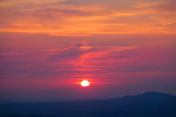 Breathtaking shot of the colorful evening sky illuminated by the golden sun.