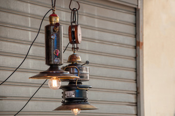 Retro light lamps with Edison light bulb on a grunge background, flea market