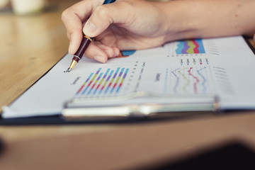 Close-up Of Businesswoman Analyzing Graph in the office - Image